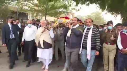 PM Modi carries the mortal remains of his late mother Heeraben Modi in Ahmedabad, Gujarat