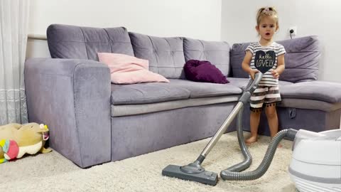 Adorable_Baby_Girl_Vacuuming_for_the_First_Time