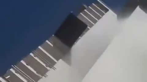 rocket hits buildings and man falls
