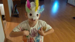 Toddler puts turkey mask on and squawks like a turkey