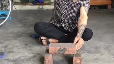 Fake Martial Arts Master Performing A Brick Challenge