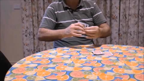 A Playing Card Slices Into The Magician's Arm