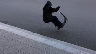 Kid black sweater jump scooter fall back