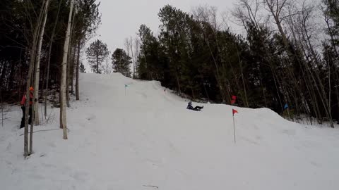 Snowmobile Flipping During Hill Climb