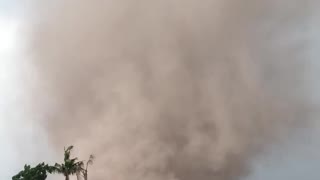 Tornado Sweeps Through Farmland During Summer Storm