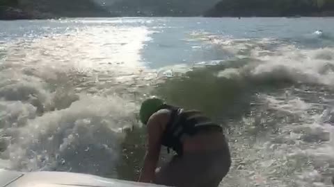Wake surfing - The Kid makes it look Easy.