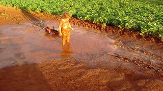 Kid Has Some 'Old Fashioned Fun' In A Muddy Puddle