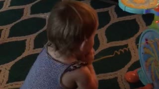 Baby rocks out to daddies drumming