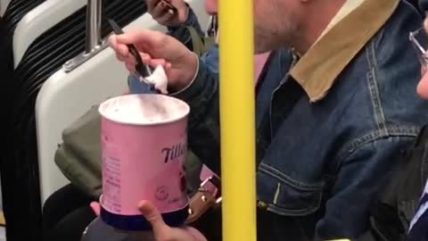 Old man eats entire tub of vanilla tillamook ice cream on subway train