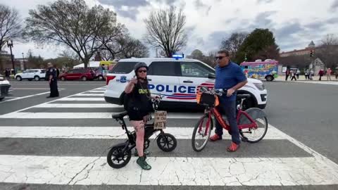 The People's Convoy Confronted by Crowd and Woman on Bike in DC 3-18-22