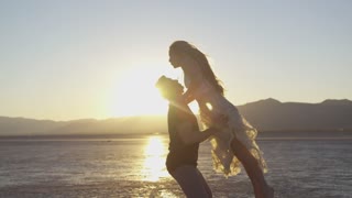 Couple dancing on sunset background great video