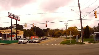 Dash cam footage captures oblivious driver's near miss