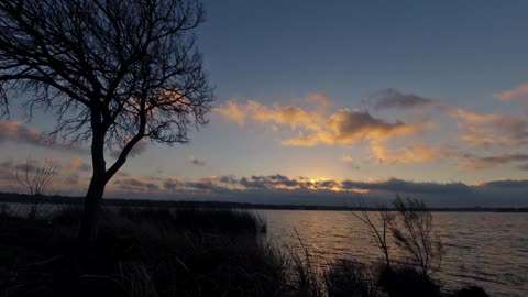 Breaking Sunrise Over a Lake