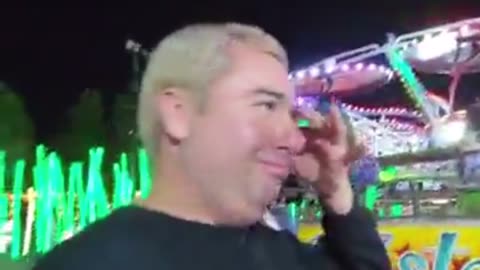 Dramatic Friend Celebrity Lookalike Gets off a Ferris Wheel