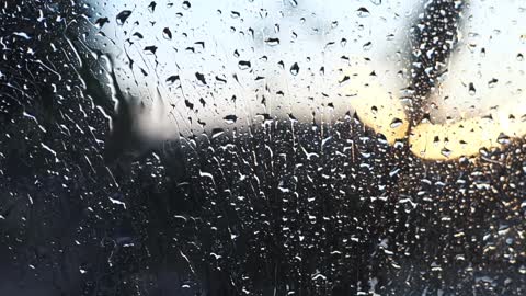 Sounds of rain outside the window.