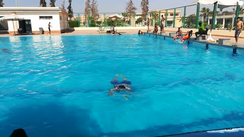 Back Back Swim In Pool By Expert Diver