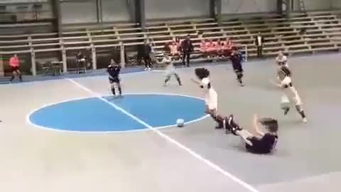 a cute woman playing futsal