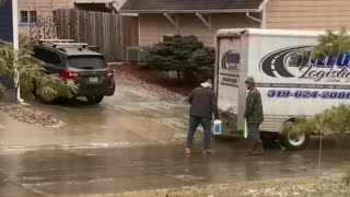 Determined Delivery Drivers Slide Package to Destination
