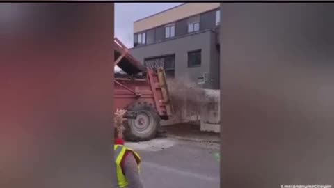 French farmers drop manure front of a taxation center, gas stations and other government buildings.