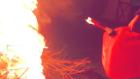 Girl pours gas onto fire gas tank slightly on fire after