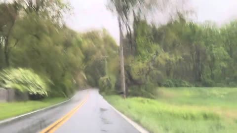 Driving on Country Road in a Rainy Day