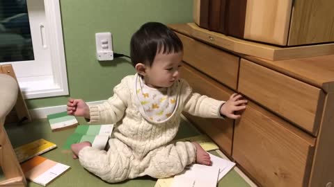 This sweet toddler has a surprise hiding in the drawer