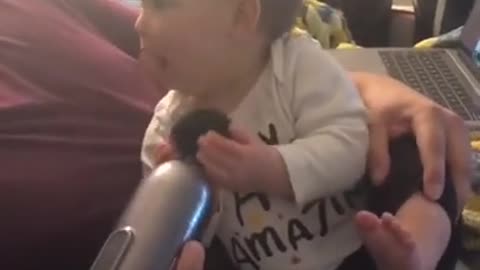 BABY WITH MASSAGE GUN FUNNY