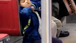 Kid in blue jacket signals cutting throat