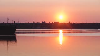 Beautiful Time Lapse Video of a Sunrise in a Port with Birds Flying by