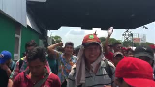 Migrant caravan from Central America crosses into Mexico from Guatemala on trek to America