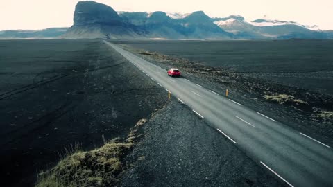 Car Driving Through Icelandic Landscape