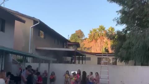 Girl Jumping into Pool From Roof Falls Short