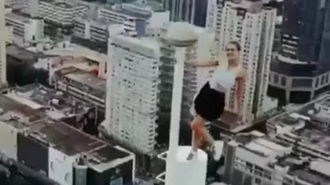 girl climbs to the top of a tower