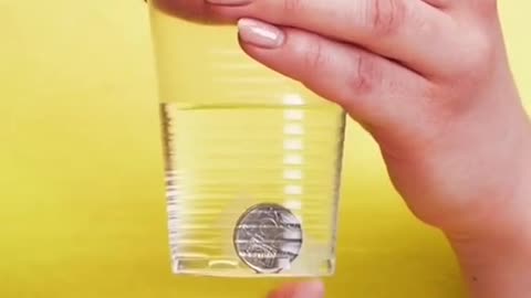 DIY coin through water cup magic trick
