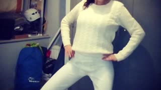 Girl in white shirt and pants dancing