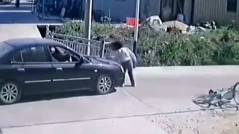 Girl hit by car on bike miraculously survives and continues to skate on her phone