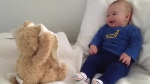 baby and teddy laughing a lot