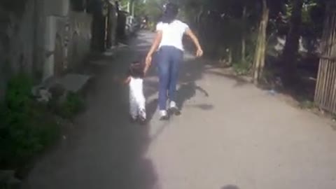 Cute 2 Year Old And Mom Run And Play In The Neighborhood