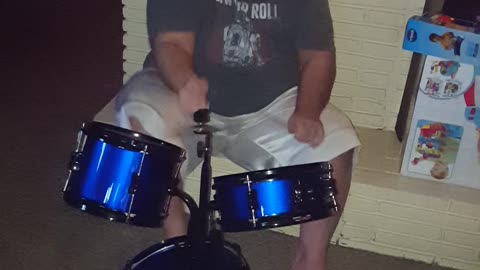 Playing his nephews drum set out