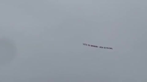 "Let's Go Brandon" Banner flying over Trump's Rally