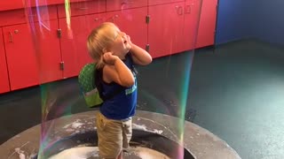 Cute Kid in a Big Bubble