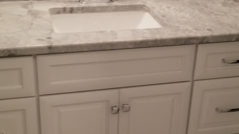 Bathroom update, new tile floor, new vanity, lights, and mirror, paint, hardware, and trim.