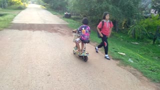 Young girl rides her bike like a veteran.