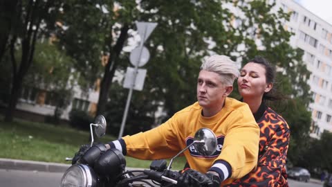 a-couple-on-a-road-trip-riding-a-motorcycle