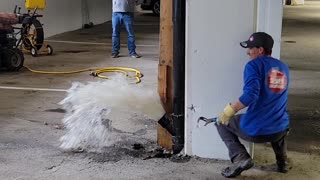 Opening a Sewer Pipe Inside a Garage