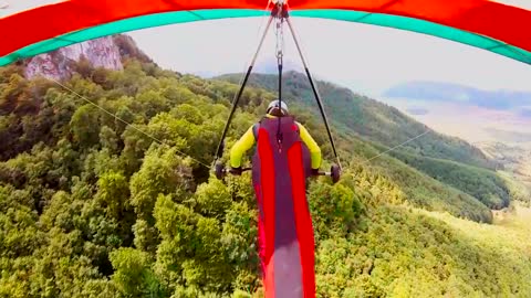 POV hang-gliding over stunning Carpathian Mountains