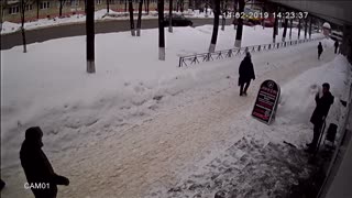 Ice Block Miraculously Misses Pedestrian