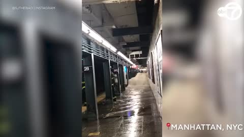 Video: Flood waters gush into NYC subway stations
