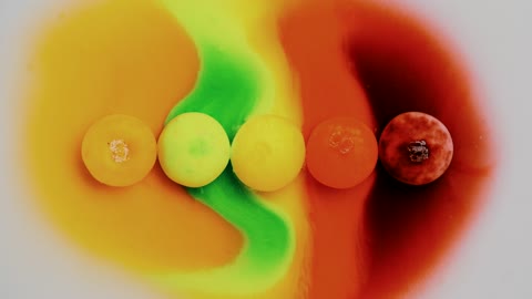 Cool Time Lapse Video of Candies Submerged In Water Dissolving
