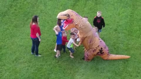 Group Of Kids Ambush Man In A T-Rex Costume